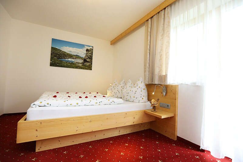 Room with double bed and balcony in Haus Maria in Gerlos